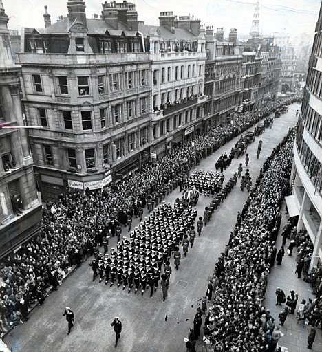 Somewhere in all the photographic coverage of the event there's an image of a tall, skinny young student in a sheepskin jacket slipping along behind the silent crowds, keeping up with the procession. I've never been able to find that image, but it must be there.